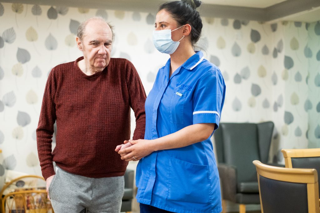 Res and Carer holding hands 2